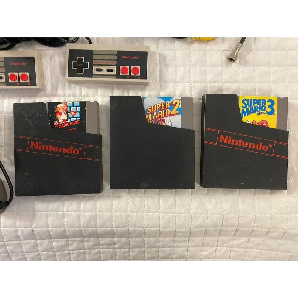 authentic NES Console Bundle with Super Mario Bros. 1,2,3 and 2 Controllers gun